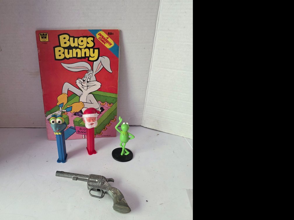 Bugs Bunny  Comic Book, Santa Pez Dispenser,  Kermit the Frog Figurine,  Toy Metal Gun