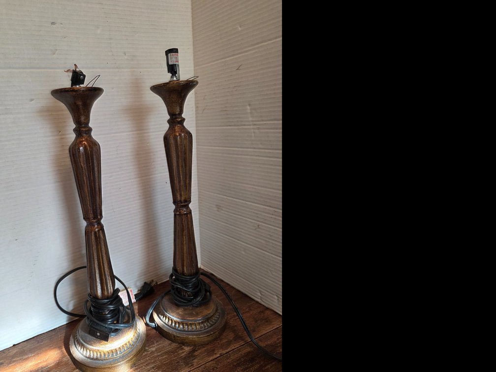 Turned candlestick lamp base featuring a classic fluted column design