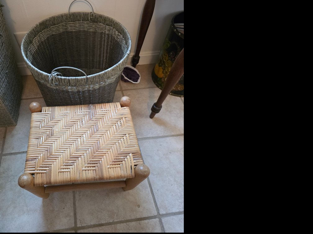 Hand-woven grey wicker and rattan storage basket featuring built-in hoop handles and a structured square base: footstool features a classic herringbone-patterned hand-woven rush seat set
