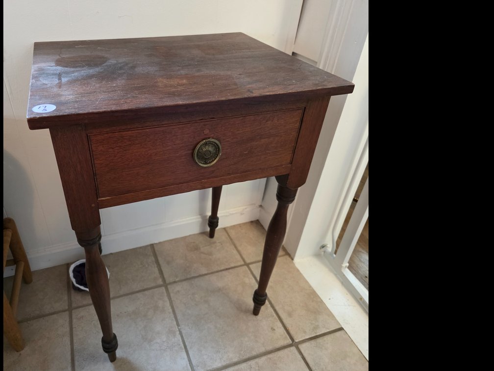 Wooden one-drawer side table or stand featuring a rich wood patina and delicately Carved Legs