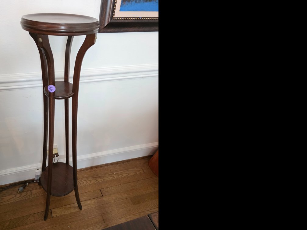 Dark wood three-tier plant or fern stand featuring a rounded top, a middle shelf, and a lower base