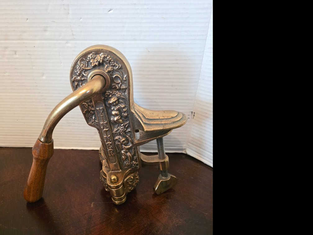 Vintage Rogar Vintner solid brass table-mount corkscrew with cherubs and grapevines in an Art Nouveau Style