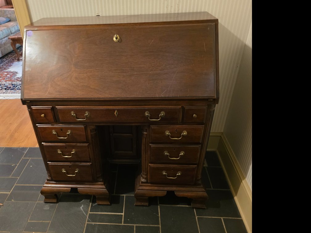 American Drew vintage mahogany slant-front kneehole secretary desk, classic brass batwing drawer pulls and fold-down writing surface.