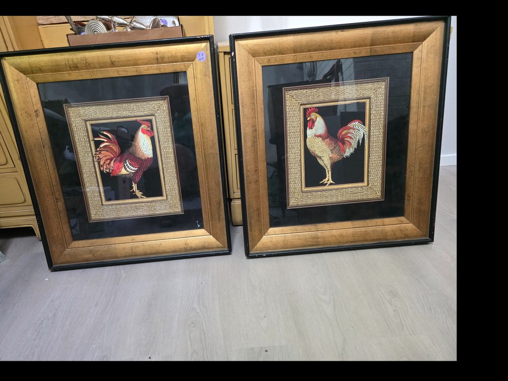 Ornate square wall art piece featuring a colorful rooster print set inside a textured gold inner frame, a wide black mat, and a distressed gold-and-black outer wooden frame.
