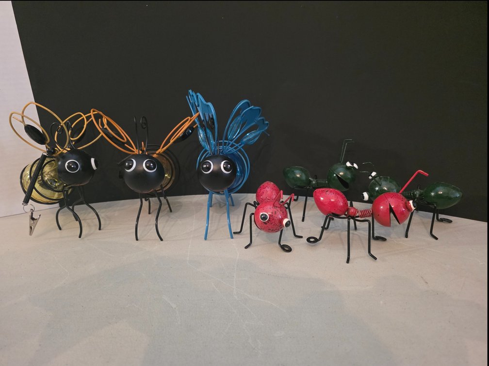 Metal Ant Figurine Sculptures designed as colorful, whimsical insect art for home or garden decor.charming blue metal solar butterfly garden light featuring a decorative glass globe body and bouncy springs.
