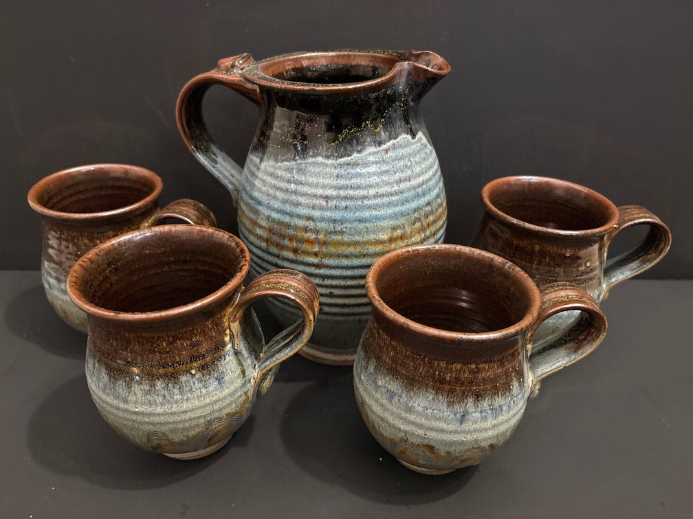 handcrafted studio pottery pitcher and matching 4-piece mug