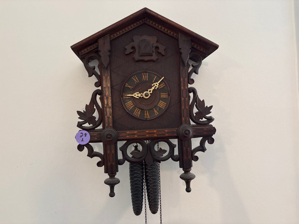 Carved Wooden Cuckoo Clock – Traditional Black Forest Style with Pine Cone Weights