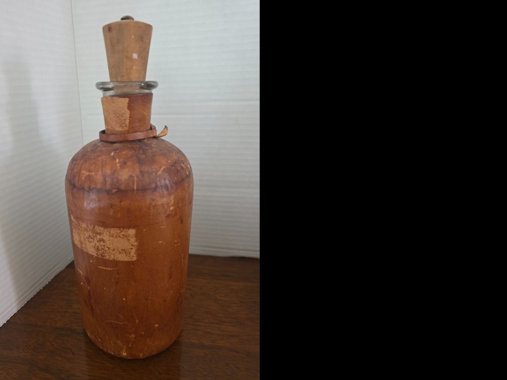 Vintage leather-wrapped glass decanter or liquor flask