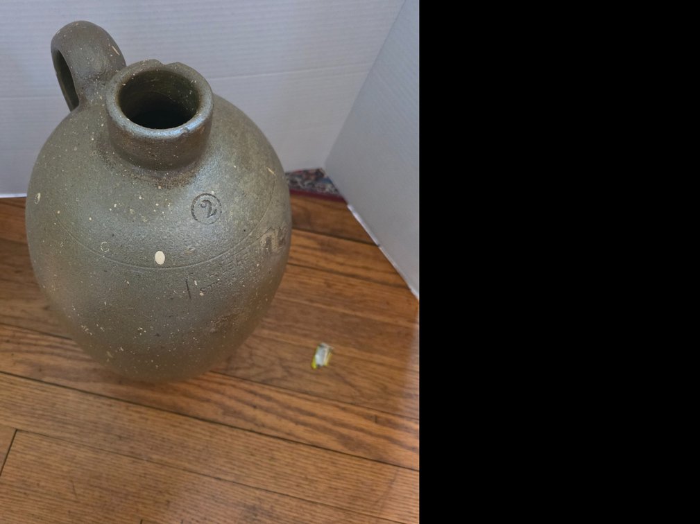 Single-handled stoneware jug with an  salt-glazed surface,