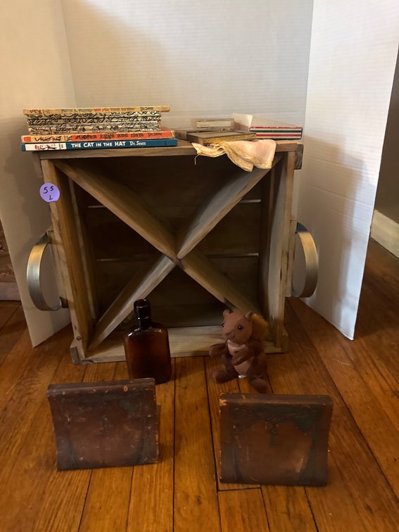 Small bookshelf with Dr Seuss Books and housewares