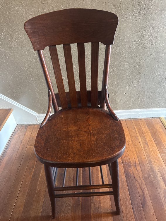 Antique Style wooden chair featuring a classic schoolhouse Spindle Back