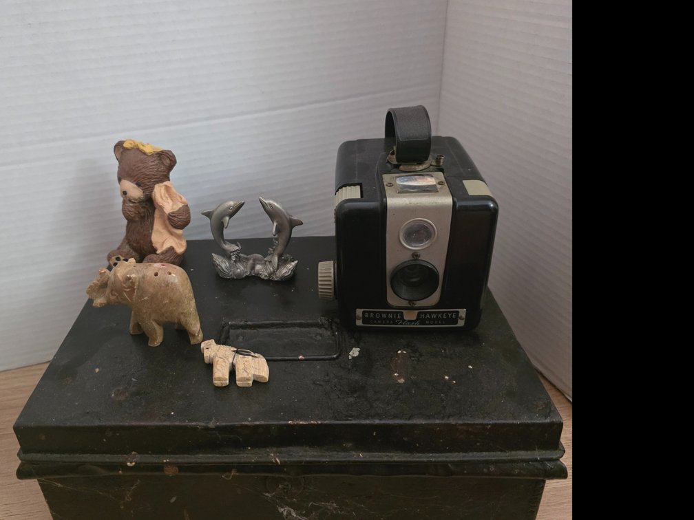 Hand-carved soapstone or serpentine stone elephant figurine featuring vertical holes:  Brownie Hawkeye Camera  Flash Model,  Pewter Dolphin