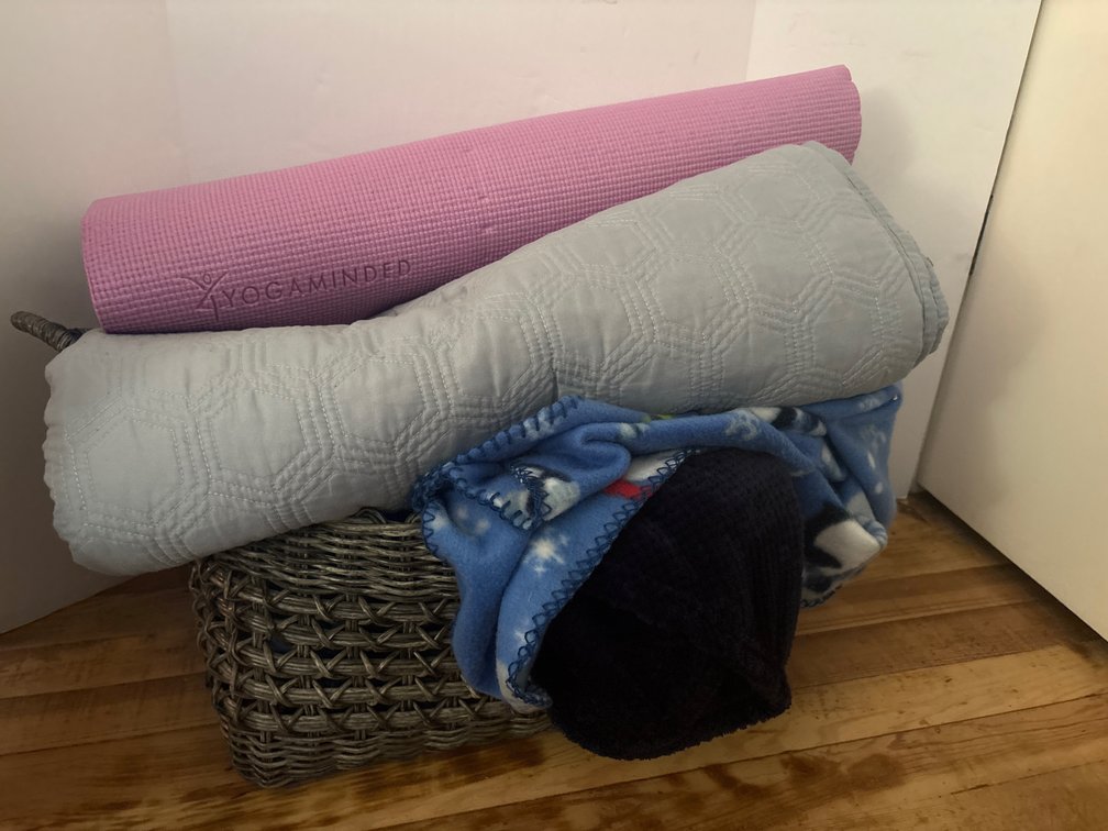 Basket with Blankets and Yoga Mat