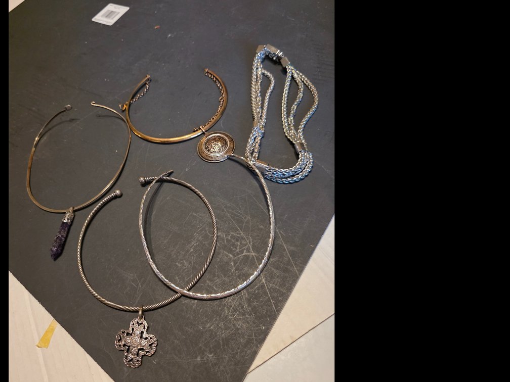 Rigid, open-ended silver-tone metal collar necklace;  gold-tone metal collar necklace featuring a faceted purple stone etc