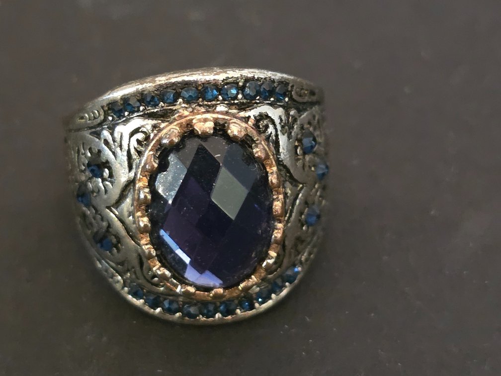 Turkish-style handmade 925 sterling silver ring featuring a large oval blue-faceted stone