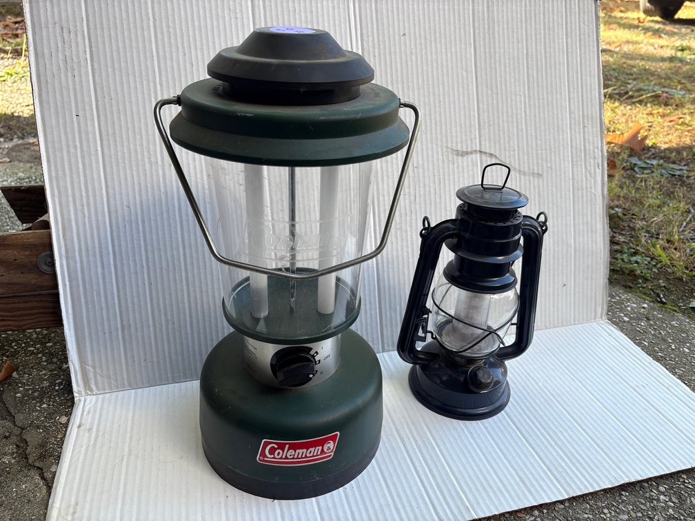 Lanterns - Green Coleman Battery Lantern & Black Hurricane Style Battery Powered Lamp