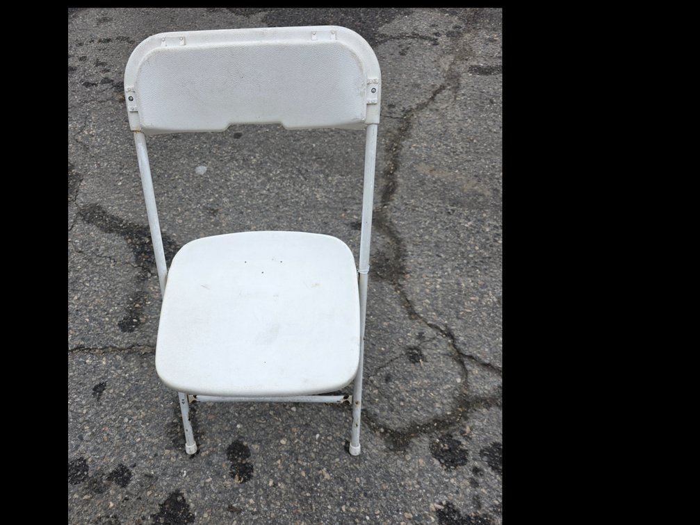 White Plastic and Metal Folding Chairs