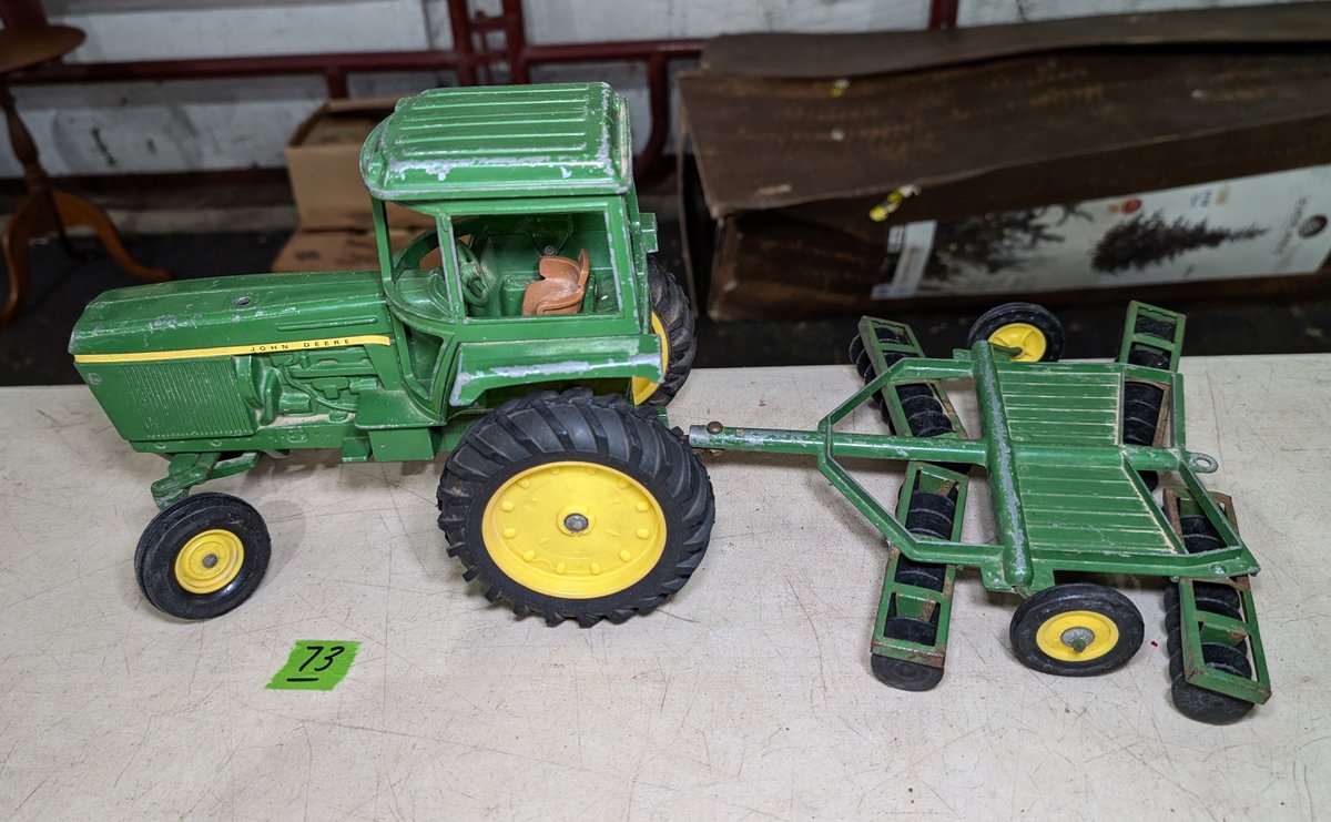 John Deere Metal Tractor pulling a Disc