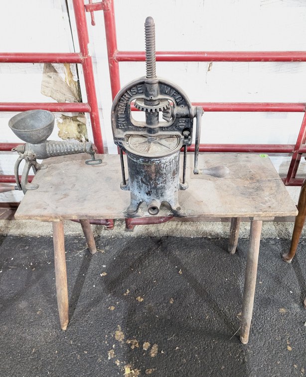 Table with 2 Cast  Fruit Presses Attached 