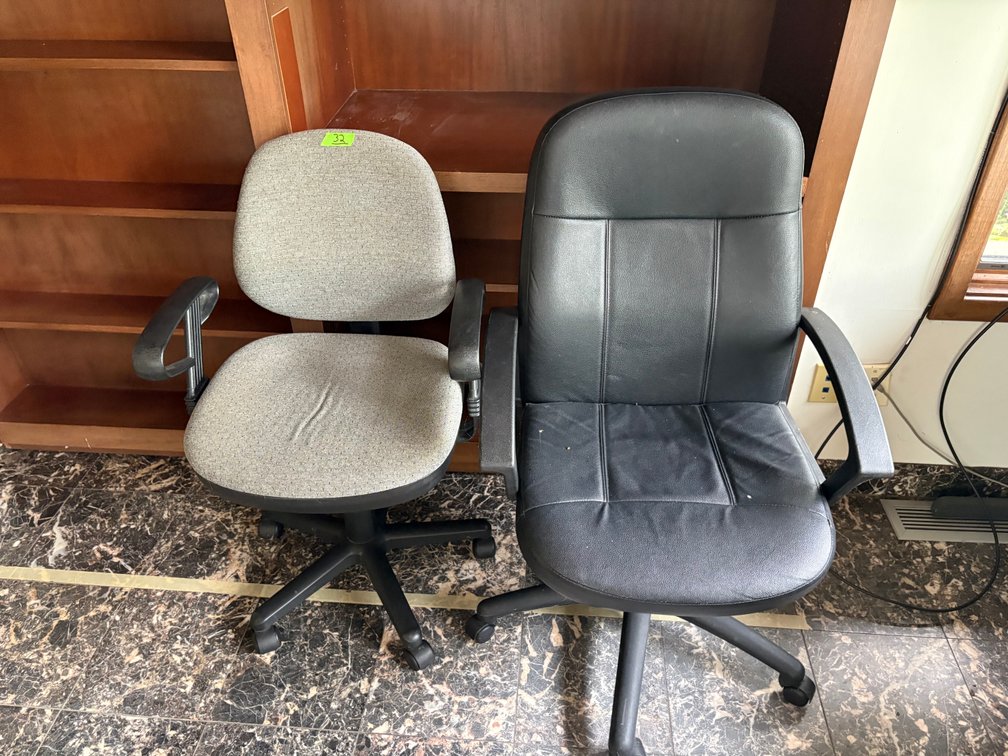Pair of Office Chairs: Grey Fabric Task Chair and Black Faux Leather Executive Chair