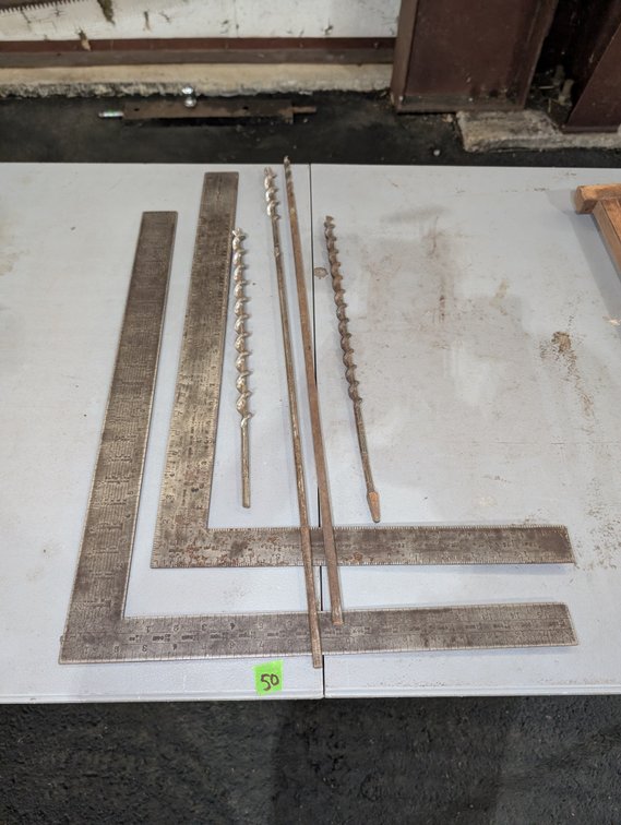 Group of Steel Framing Squares and Long Hand-Auger Drill Bits