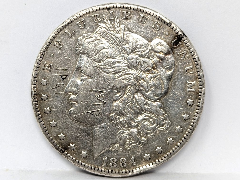 1884-CC Morgan Dollar, Damaged