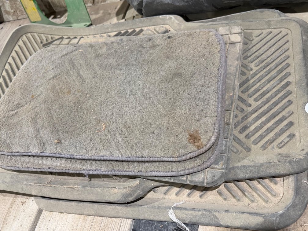 Miscellaneous stack of floor mats