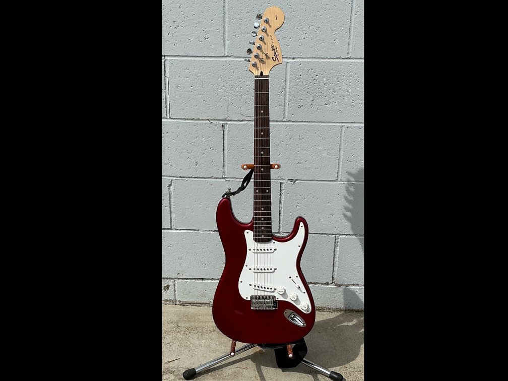 Squier by Fender Guitar with case & amp & music book