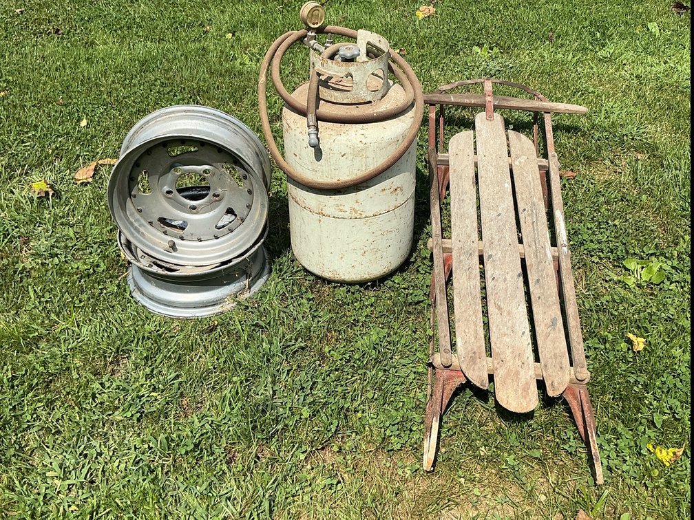 2 steel wheels 1 runner sled and portable air tank 