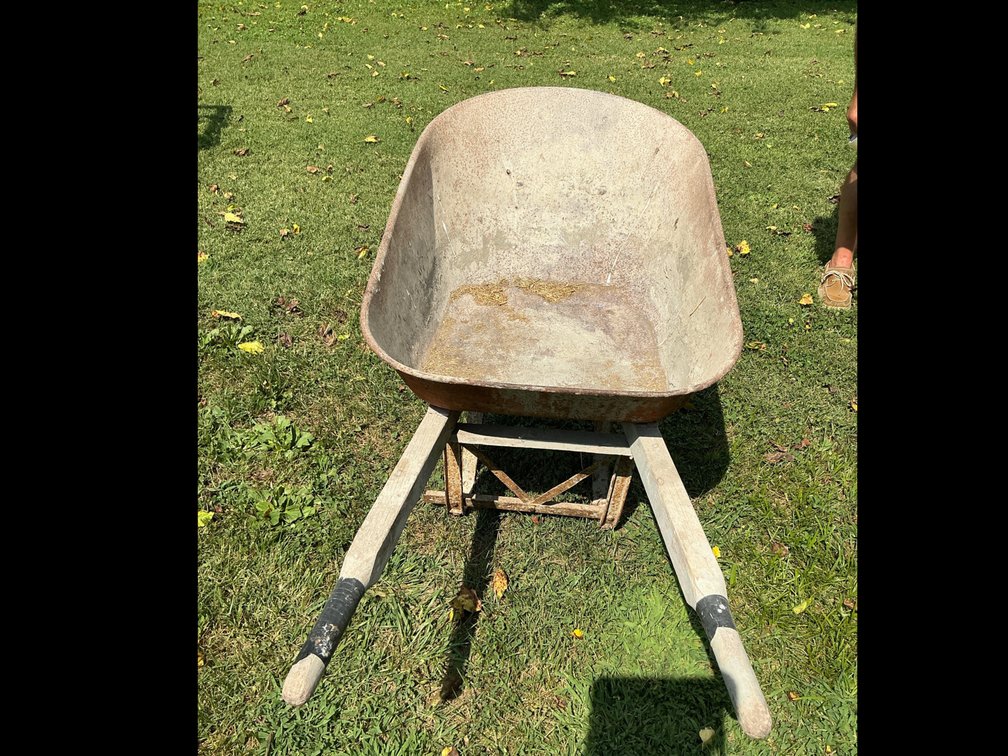 One wheelbarrow and one lawn spreader