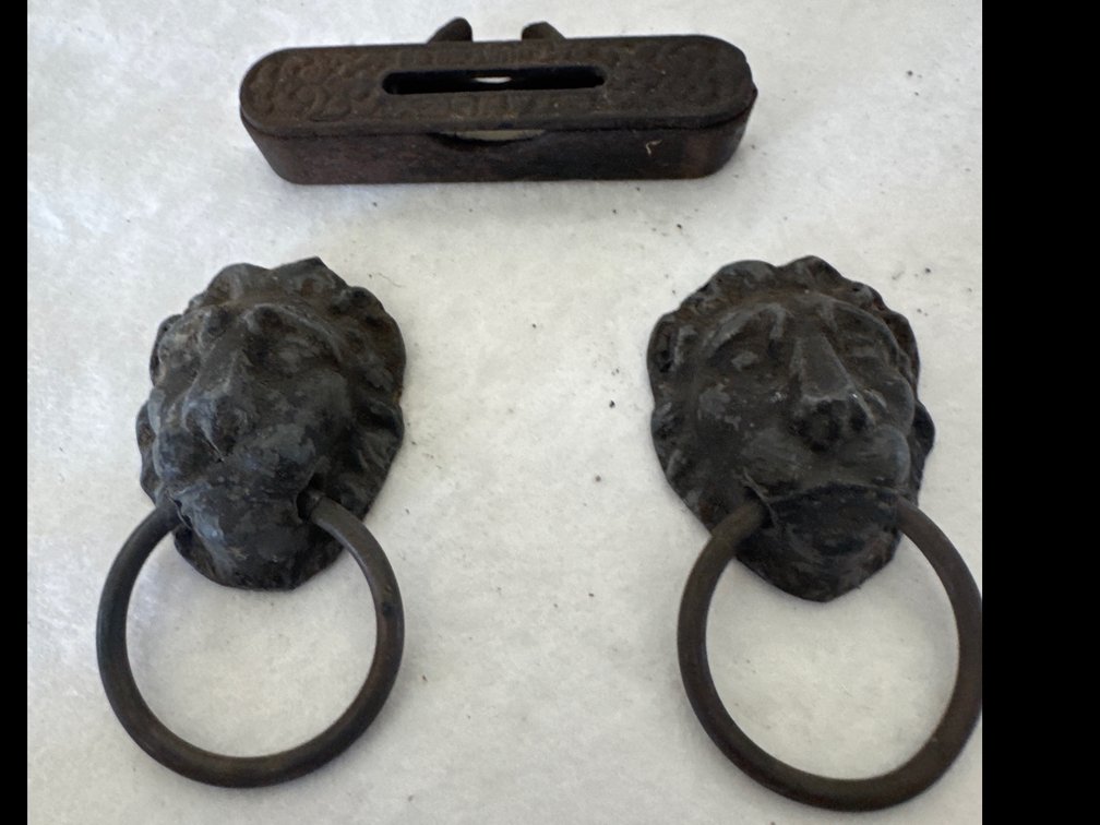 Cast Metal Lion Head Ring Pulls, Slotted Plate, and Cast Iron Line Level