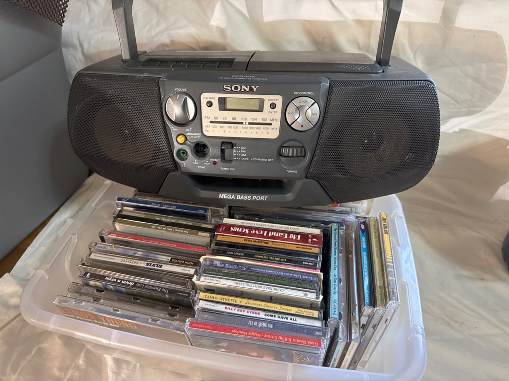 Portable CD Radio Cassette-Corder Boombox and Container of Compact Discs
