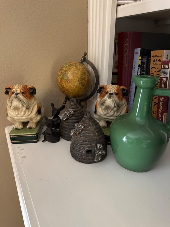 Decorative Items Featuring Globe, Bulldog Figures, and Ceramic Vase