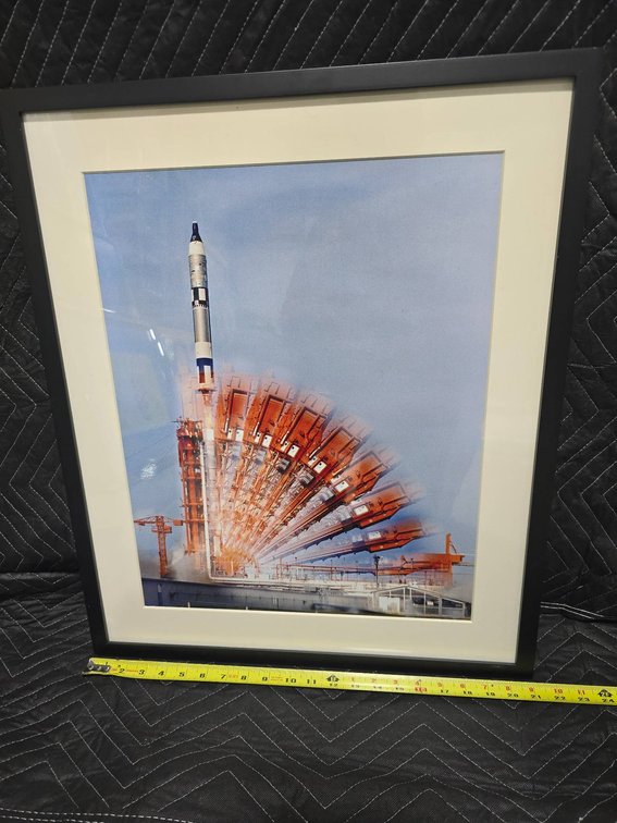 Framed Artwork Featuring Rocket Launch Illustration