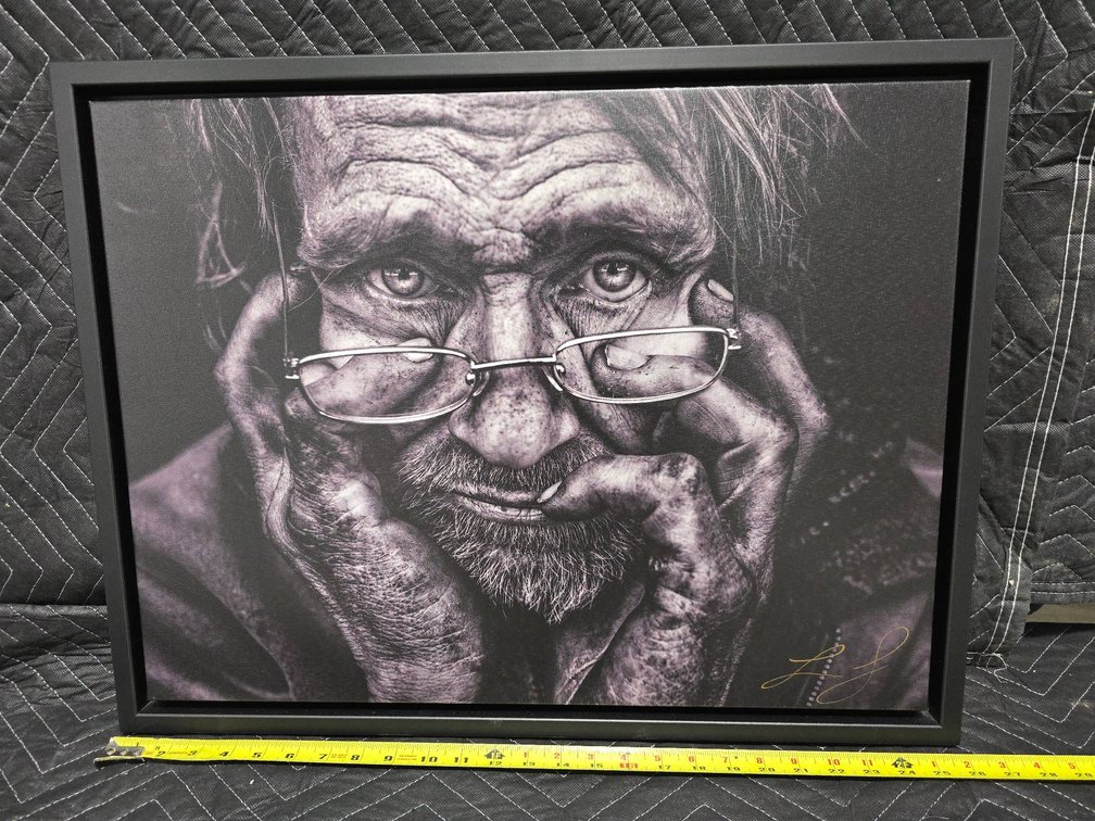 Framed Canvas Print Featuring a Portrait of an Older Man with Glasses