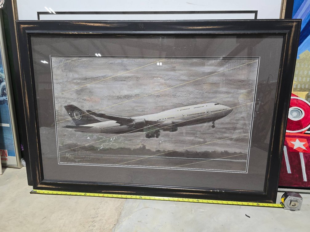 Framed Artwork of Airplane in Flight With Artist Signature