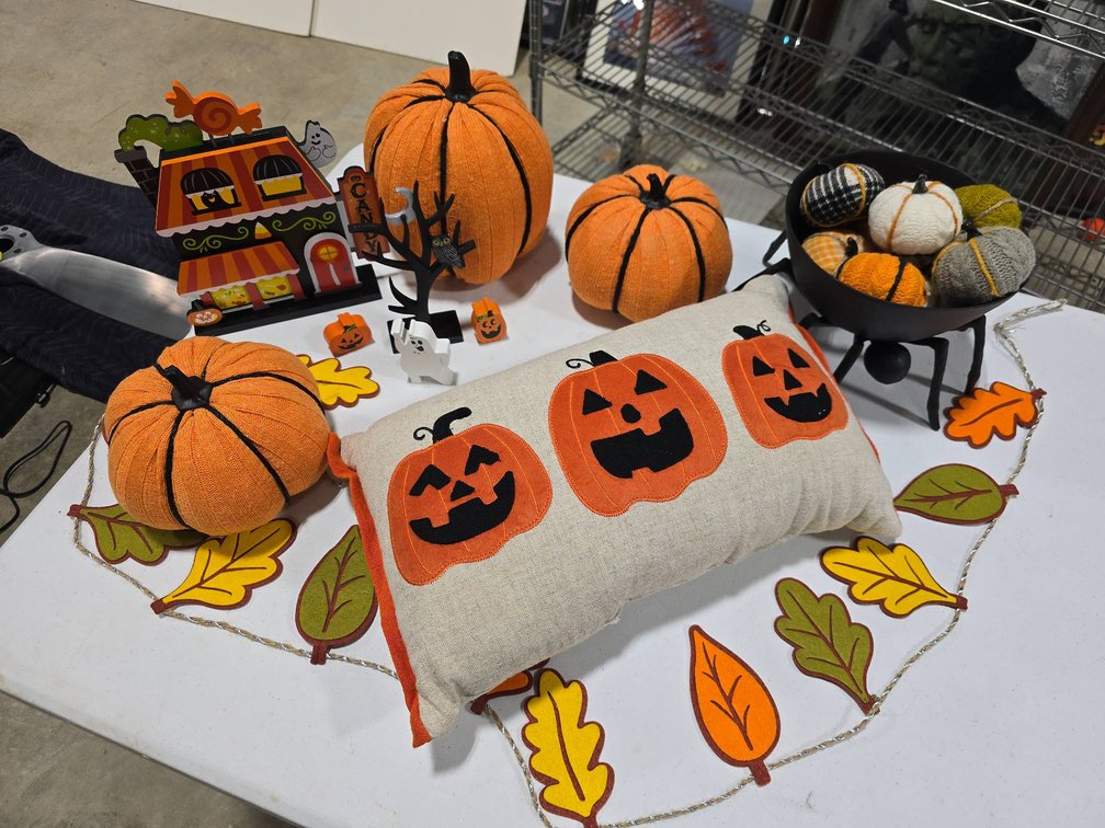 Halloween-Themed Decorations Including Pumpkins and Garland