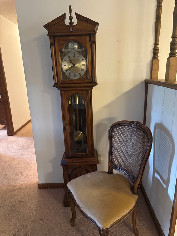 Howard Miller Grandfather Clock and Cane-Back Chair