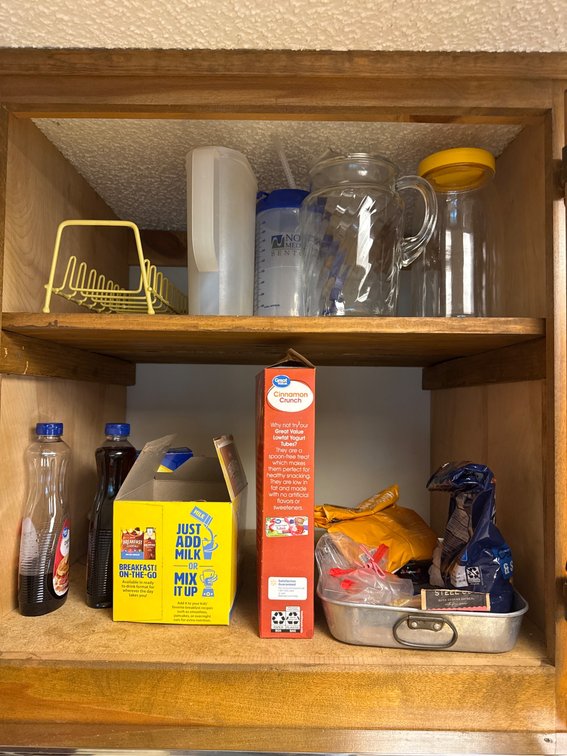 Kitchen Items Including Containers, Rack, and Food Boxes