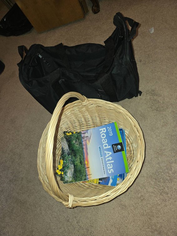 Wicker Basket, Small Duffel Bag, and Road Atlases