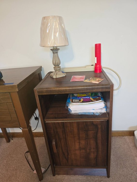 Small Wooden Cabinet With Lamp and Accessories