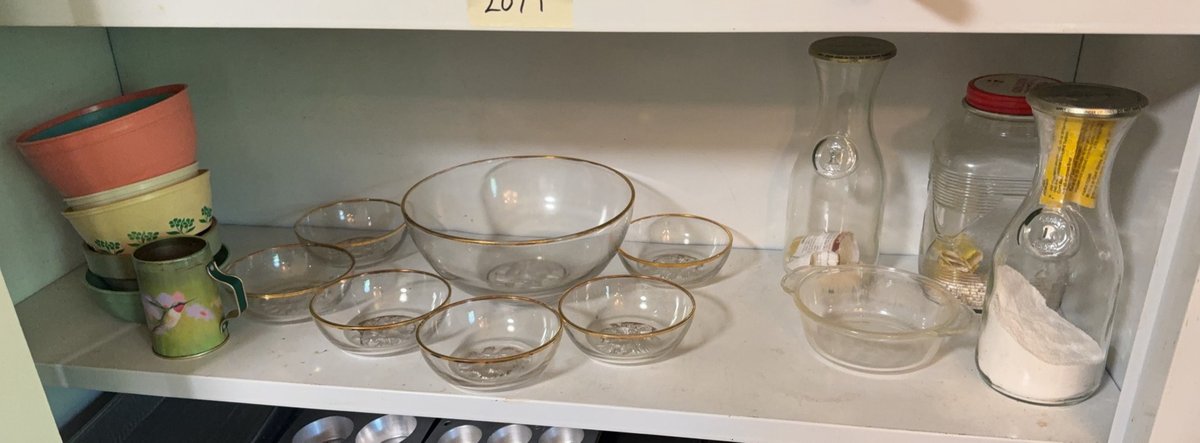 Glass, Plastic, and Metal Kitchenware on One Shelf