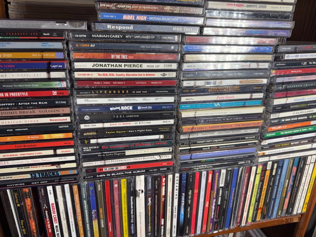 Large Assortment of Music CDs Featuring Pop, Rock, and Country Artists