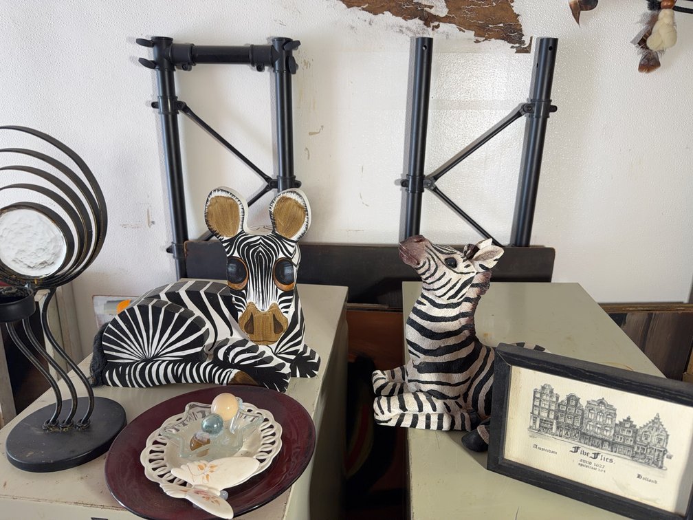 Decorative Lot: Zebra Figurines, Framed Art, Black Metal candle Lamp, Red Pail