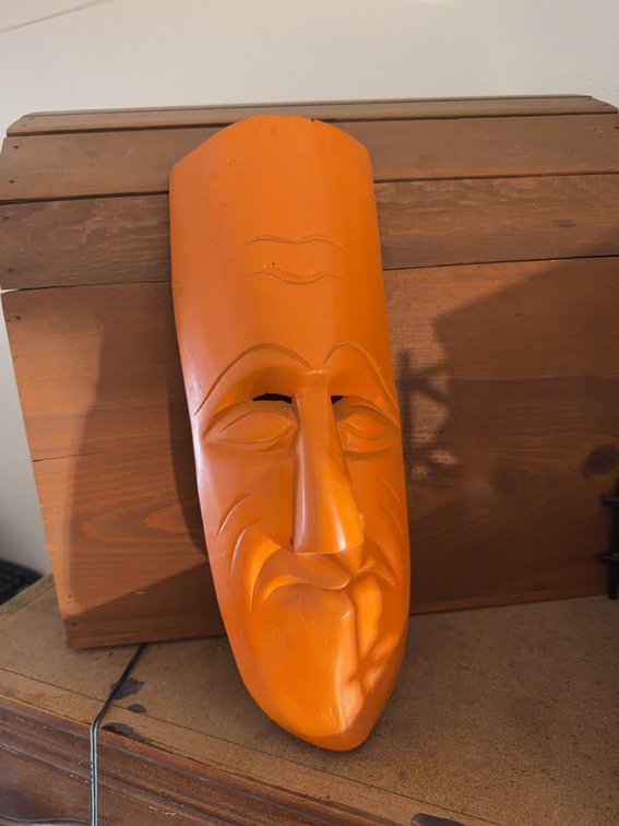 Hand-Carved Orange Wooden Mask and Hinged Wooden Storage Chest