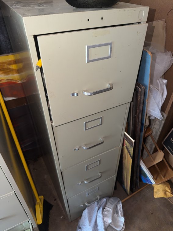 Four-Drawer Metal Filing Cabinet With Mixed Electronics and Miscellaneous Items