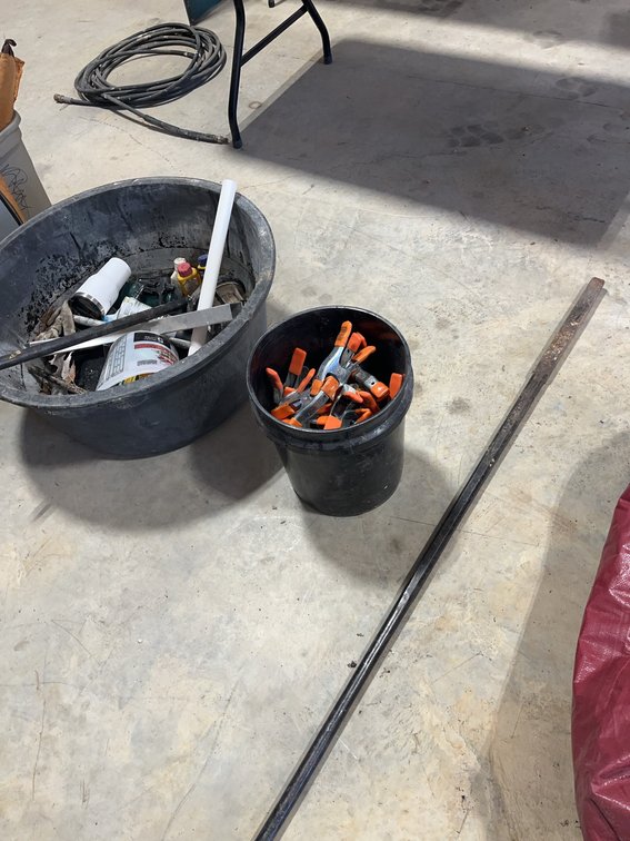 Bucket of Spring Clamps With Miscellaneous Shop Items and Steel break away Bar
