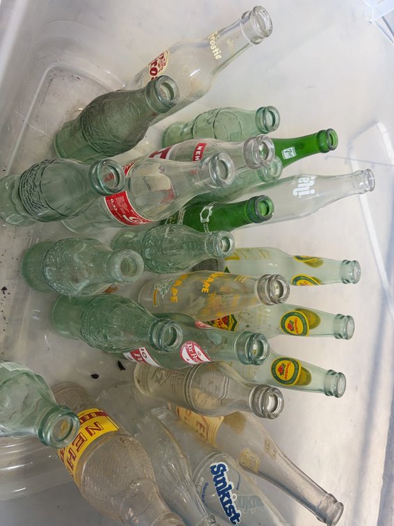 Vintage Glass Soda Bottles Including Frostie, NuGrape, Cheerwine, Dr Pepper