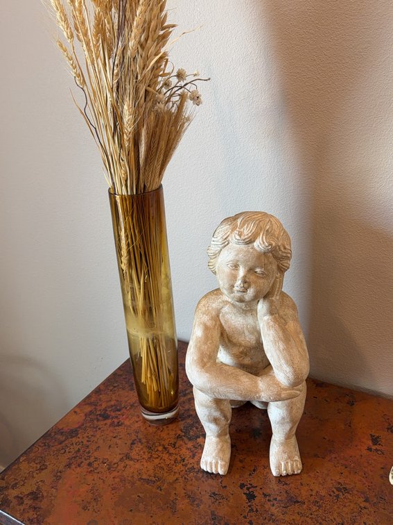 Seated Cherub Resin Statue and 14-Inch Amber Glass Vase With Dried Wheat