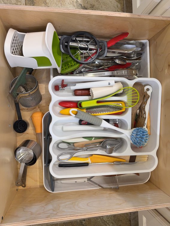 Kitchen Utensils Including Cutlery, Tongs, Peelers, and Measuring Cups